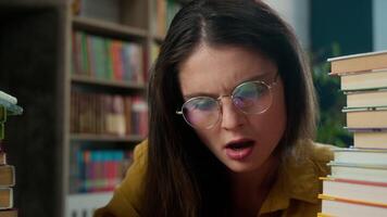 Tired exhausted Caucasian woman student girl yawn studying books in library high school university college female teacher overwork sleepy yawning boring course lecture insomnia fall asleep sleeping video