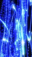 Abstract blue digital rain with luminous vertical trails of particles, representing data streaming or futuristic visualization video