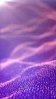 Soft-focus violet background with glowing particles forming undulating waveforms under sunlight video