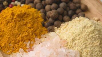 Assorted aromatic, natural and fragrant spices. Different variations of spicy and spicy Indian and oriental spices for seasoning food video