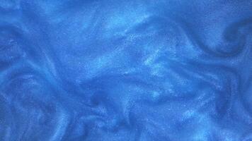 Amazing abstract texture background. Abstract blue background with sequins. Mother-of-pearl liquid with a shiny metallic sheen, movement, cosmetic gel. video