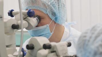 Surgery team making strabismus surgery using modern technologies, latest devices, microscope in modern clinic 8 video
