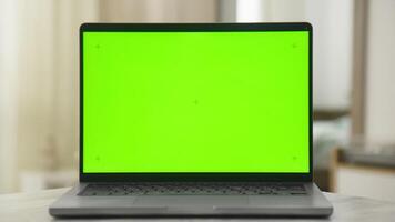 Laptop with Green Screen on Table Ready for Custom Content Display video