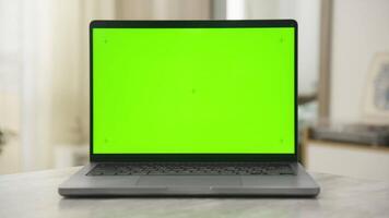 Laptop with Green Screen on Table Using Dolly Zoom Effect video