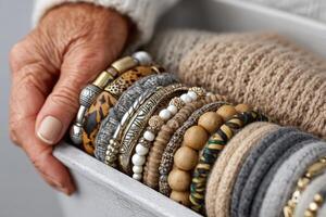 Assorted bracelets displayed in a cozy setting, showcasing various materials and designs, highlighting personal style and creativity photo