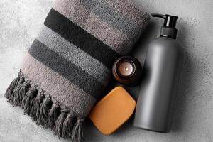 Relaxing spa essentials arranged neatly on a textured surface for a rejuvenating experience photo