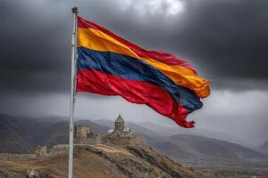 Waving Armenian flag in front of ancient monastery under dark clouds photo
