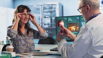 Medical professional examines patient reaction to light for concussion assessment, checking for dizziness, sensitivity and balance issues. Physician does a neurological checkup. Camera B. video