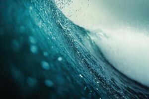 Majestic ocean wave crashing with vibrant blue hues at sunrise on a tranquil beach photo