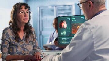 Male doctor performing a neurological examination with a pen light to assess a patient cognition, pupil response and reflexes, checking for signs of concussion or brain injury. Camera B. video
