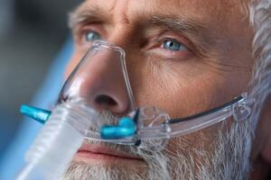 Man receiving medical treatment with oxygen mask in a hospital setting during daytime photo