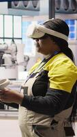 Vertical Photovoltaics smart factory expert using VR tech to manage automation systems. Solar panels industry 4.0 plant technician using virtual reality gear to evaluate equipment, camera A video