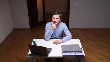 Office worker having an idea while working at his desk video