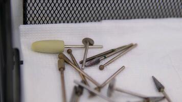 there are manicure tools on the table Silver nail scissors on mirrored surface video