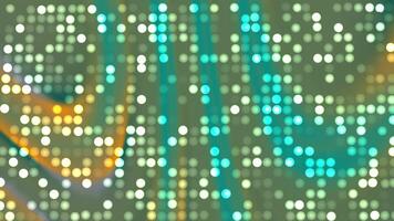A digital background featuring glowing white dots scattered across a green and yellow gradient with subtle wave patterns. The design creates a vibrant, futuristic effect with an energetic atmosphere. video