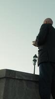 Silhouette Of A Man Taking A Photograph From The Panoramic View Of The City video