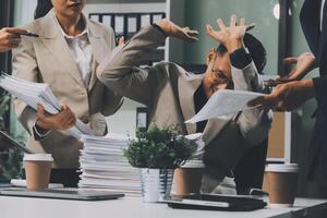 A group of business people are working at their desk photo