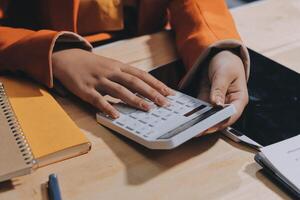 A woman's hands on a calculator photo