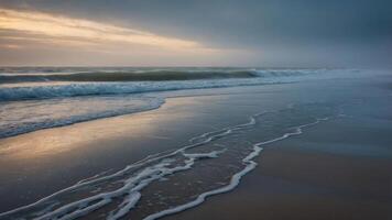 A serene beach scene at dusk, with gentle waves lapping at the shore under a cloudy sky. photo