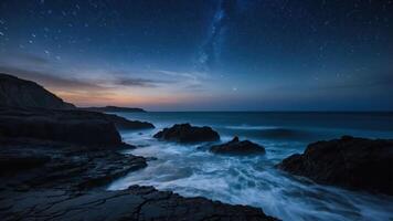 A serene night scene of the ocean under a starry sky, capturing the beauty of nature. photo