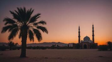 A serene sunset view of a mosque surrounded by palm trees and mountains. photo