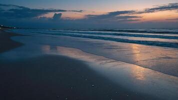 A serene beach scene at sunset, with gentle waves and a reflective shoreline. photo