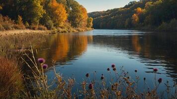 A serene river scene with autumn foliage reflecting in the water. photo