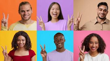 A joyful and diverse group of people is expressing happiness and success with V gestures against vibrant, colorful backgrounds. Their smiles radiate positivity and unity in celebration. video