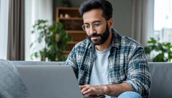 Freelancer working on laptop home office digital nomad cozy environment engaged viewpoint productivity concept photo