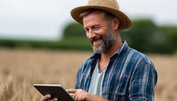 Farmer using tablet in wheat field rural area lifestyle photography natural setting close-up view digital agriculture photo