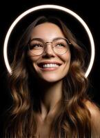Joyful woman smiling with glasses studio portrait dark background close-up positive vibes photo
