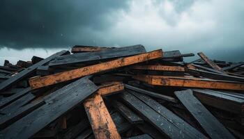 Stormy skies over a pile of weathered wooden planks industrial site landscape dramatic environment low angle view photo