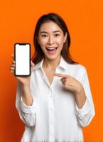 Exciting smartphone promotion studio setup digital content vibrant orange background engaging viewpoint photo