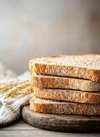 Freshly sliced whole grain bread stacks on rustic wooden board kitchen setting close-up photography photo
