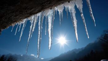 Icicles hanging from rocks mountain landscape nature photography winter environment low angle view photo