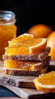 Orange jam spread on toasted bread, a sweet delight photo