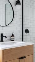 Modern Minimalist Bathroom Vanity with White Tiles and Black Fixtures photo