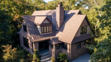 Beautiful brick house surrounded by lush greenery photo