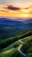 Serene Mountain Sunset Landscape with Winding Road photo