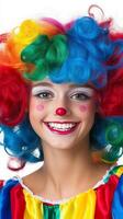 Joyful clown girl in a vivid costume photo