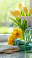 Spring Cleaning Essentials Fresh Towels, Spray Bottle, and Tulips photo