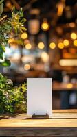 Blank Menu Sign Holder on Rustic Wooden Table in Cafe photo