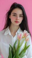 Beautiful Woman with a Bouquet of Tulips photo