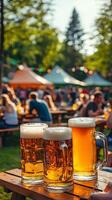 Three Mugs Of Beer On Wooden Table At Summer Festival photo