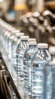 Water Bottles on Conveyor Belt in Factory Production Line photo