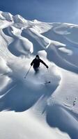 Skiing Down Powdery Slope in the Mountains photo