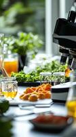 Close-up of a Microscope and Orange Slices in a Science Lab Setting photo