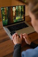 Freelancer uses ChatGPT for assistance while working on her computer. photo