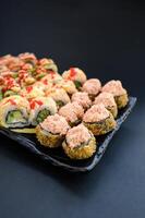Elegant sushi assortment with glossy textures and precise cuts, presented in a luxury restaurant style. photo