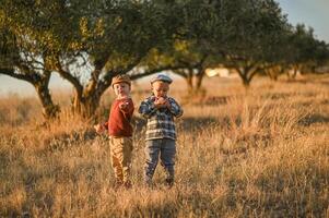 A timeless scene of boys sharing a quiet moment, olives resting in their dusty palms. photo